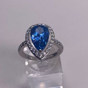 BLUE TOPAZ SIMULATED STONES AROUND CENTER -SET IN STERLING SILVER (7)